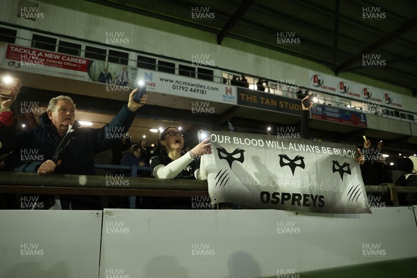 230126 - Ospreys v Emirates Lions - United Rugby Championship - Ospreys fans protest the potential changes to Welsh Rugby during the game on the 11th minute