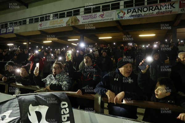 230126 - Ospreys v Emirates Lions - United Rugby Championship - Ospreys fans protest the potential changes to Welsh Rugby during the game on the 11th minute