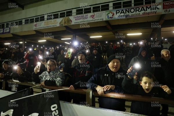 230126 - Ospreys v Emirates Lions - United Rugby Championship - Ospreys fans protest the potential changes to Welsh Rugby during the game on the 11th minute