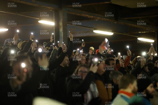 230126 - Ospreys v Emirates Lions - United Rugby Championship - Ospreys fans protest the potential changes to Welsh Rugby during the game on the 11th minute