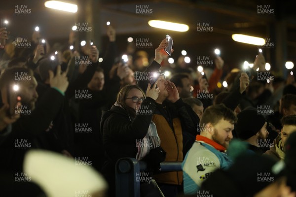 230126 - Ospreys v Emirates Lions - United Rugby Championship - Ospreys fans protest the potential changes to Welsh Rugby during the game on the 11th minute