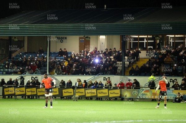 230126 - Ospreys v Emirates Lions - United Rugby Championship - Ospreys fans protest the potential changes to Welsh Rugby during the game on the 11th minute