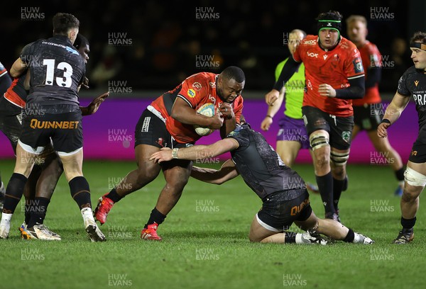 230126 - Ospreys v Emirates Lions - United Rugby Championship - Asenathi Ntlabakanye of Lions is tackled by Dewi Lake of Ospreys 