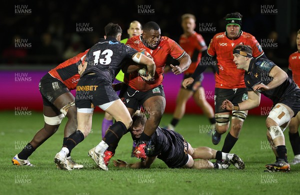 230126 - Ospreys v Emirates Lions - United Rugby Championship - Asenathi Ntlabakanye of Lions is tackled by Dewi Lake Owen Watkin of Ospreys 