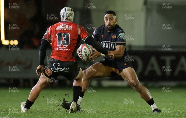 230126 - Ospreys v Emirates Lions - United Rugby Championship - Phil Cokanasiga of Ospreys is challenged by Henco van Wyk of Lions 