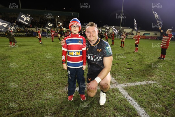 230126 - Ospreys v Emirates Lions - United Rugby Championship - Dewi Lake of Ospreys with mascot