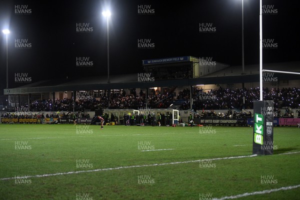 230126 - Ospreys v Emirates Lions - United Rugby Championship - Ospreys fans shine their phone lights in protest in the 11th minute