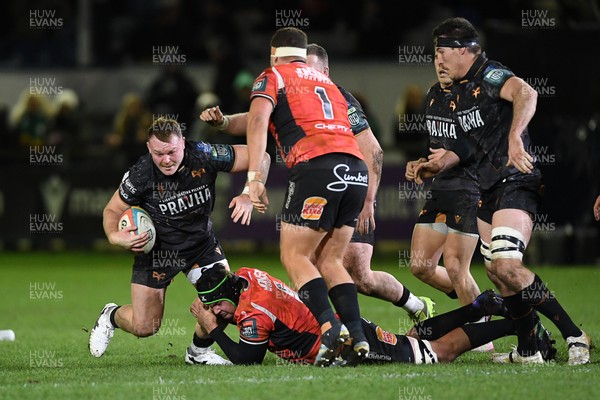 230126 - Ospreys v Emirates Lions - United Rugby Championship - Dewi Lake of Ospreys is challenged by Morne Van Den Berg of Lions