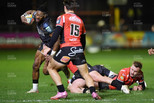 230126 - Ospreys v Emirates Lions - United Rugby Championship - Dan Kasende of Ospreys is challenged by Quan Horn of Lions