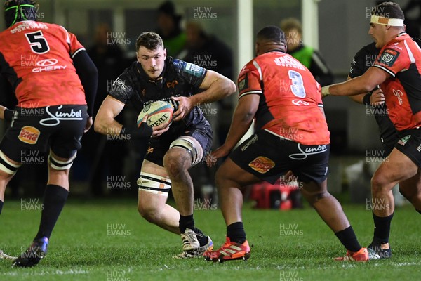 230126 - Ospreys v Emirates Lions - United Rugby Championship - James Ratti of Ospreys is challenged by Asenathi Ntlabakanye of Lions