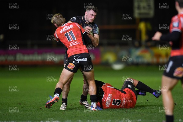 230126 - Ospreys v Emirates Lions - United Rugby Championship - James Ratti of Ospreys is challenged by Richard Kriel of Lions