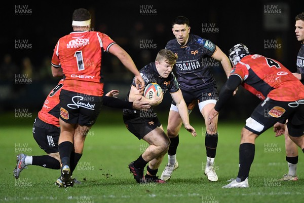 230126 - Ospreys v Emirates Lions - United Rugby Championship - Keiran Williams of Ospreys is challenged by Francke Horn of Lions