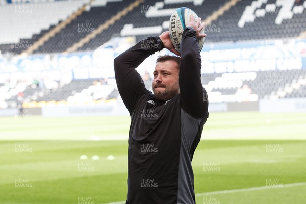 300324 - Ospreys v Emirates Lions - United Rugby Championship - Sam Parry of Ospreys warms up ahead of his 150th appearance for Ospreys