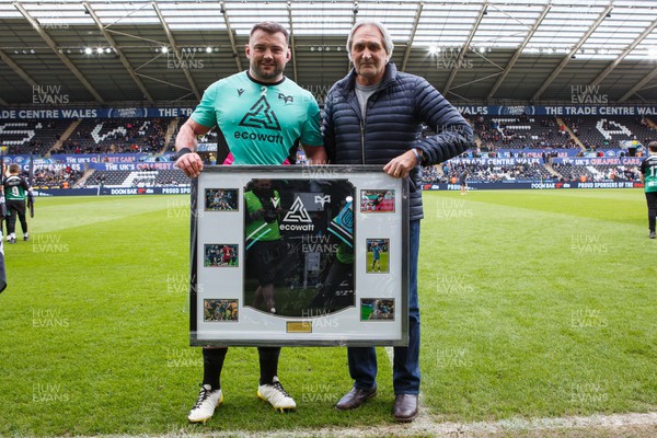 300324 - Ospreys v Emirates Lions - United Rugby Championship - Sam Parry of Ospreys is presented with a shirt on the occasion of his 150th appearance for the Ospreys