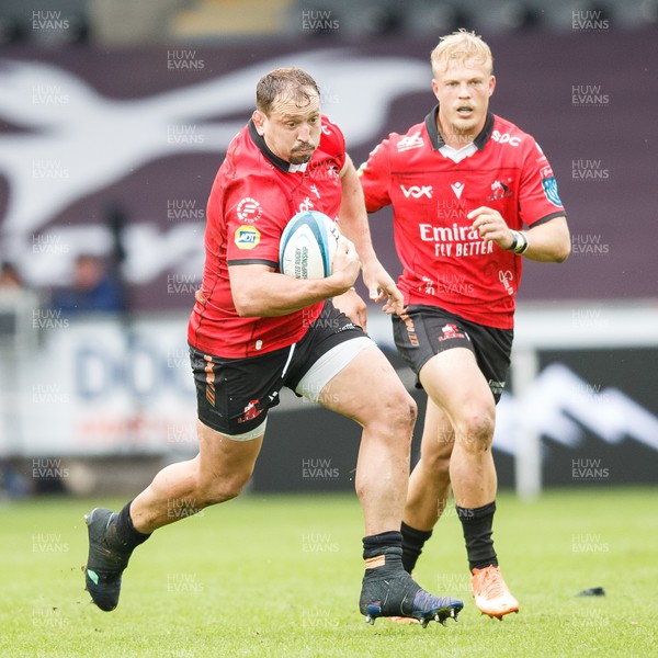 300324 - Ospreys v Emirates Lions - United Rugby Championship - JP Smith of Lions looks for a gap