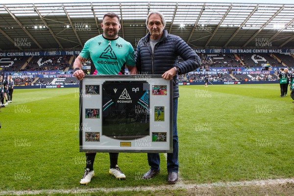 300324 - Ospreys v Emirates Lions - United Rugby Championship - Sam Parry of Ospreys receives a shirt on the occasion of his 150th appearance