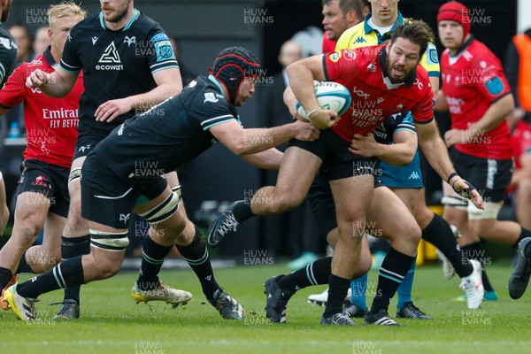 300324 - Ospreys v Emirates Lions - United Rugby Championship - Morgan Morris of Ospreys tackles Marius Louw of Emirates Lions