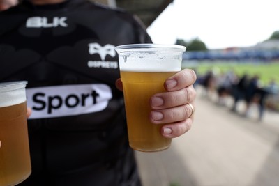 060925 - Ospreys v Exeter Chiefs - Pre Season Friendly - Fan holding beer