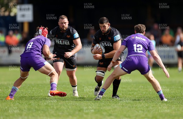 060925 - Ospreys v Exeter Chiefs - Pre Season Friendly - Rhys Davies of Ospreys is tackled by Nick Lilley of Exeter 