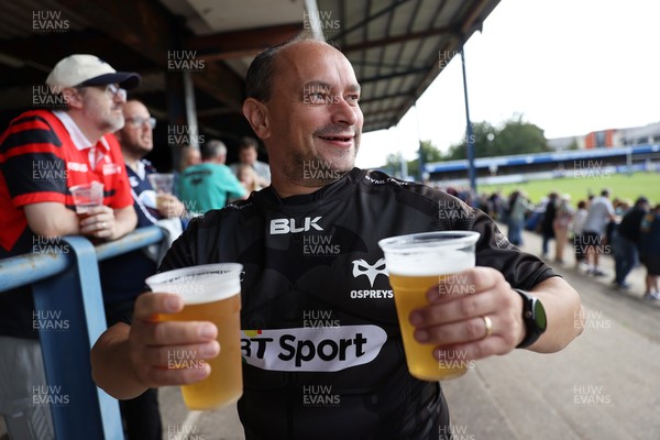 060925 - Ospreys v Exeter Chiefs - Pre Season Friendly - Fan holding beer