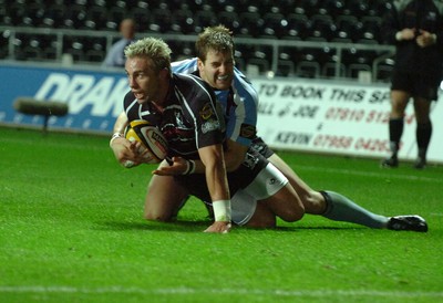 13.10.06  Ospreys v Gasgow  Ospreys Justin Marshall is tackled by Dan Parks.  