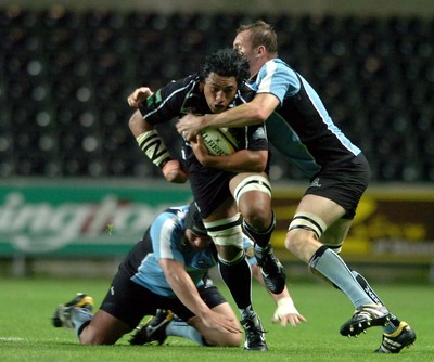 13.10.06  Ospreys v Gasgow  Ospreys Filo Tiatia is tackled by Alastair Kellock.  