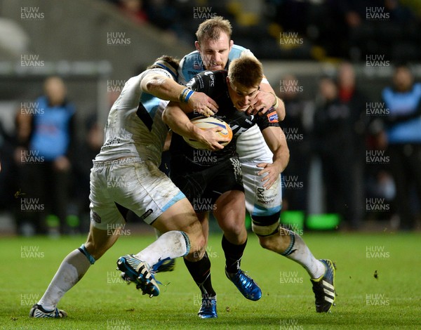 291113 - Ospreys v Glasgow - RaboDirect PRO12 -Jeffrey Hassler of Ospreys is tackled by Ed Kalman and Alastair Kellock of Glasgow