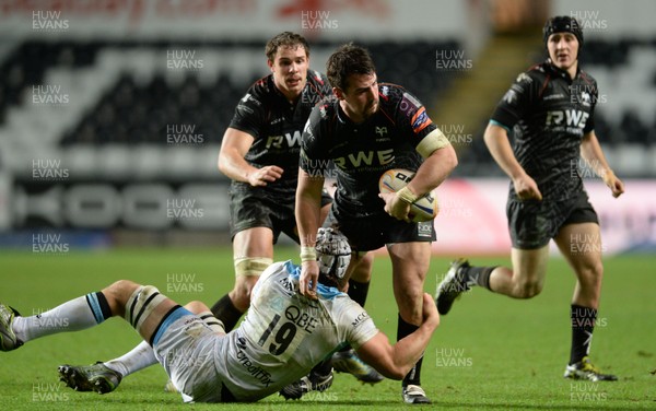 291113 - Ospreys v Glasgow - RaboDirect PRO12 -Scott Baldwin of Ospreys is tackled by Tom Ryder of Glasgow