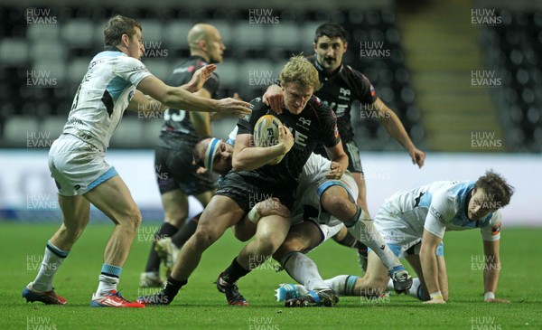 291113 - Ospreys v Glasgow Warriors - RaboDirect PRO12 - Ben John of Ospreys is tackled by Ed Kalman of Glasgow 