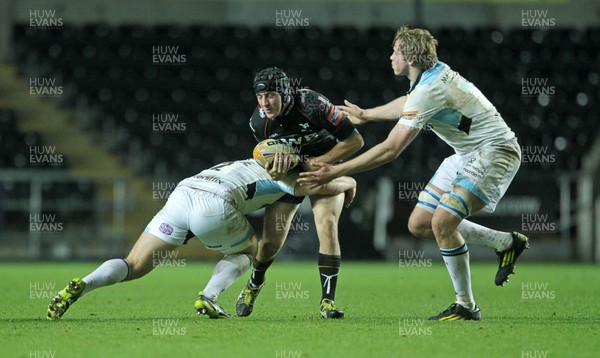 291113 - Ospreys v Glasgow Warriors - RaboDirect PRO12 - Sam Davies of Ospreys is tackled by Sean Lamont and Jonny Gray of Glasgow 