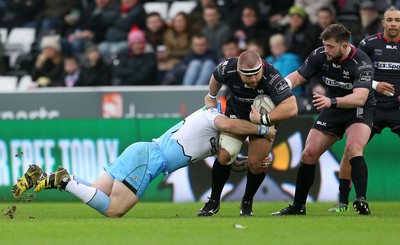 310116 - Ospreys v Glasgow - Guinness PRO12 - Dmitri Arhip of Ospreys is tackled by Gordon Reid of Glasgow