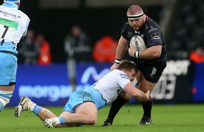 310116 - Ospreys v Glasgow - Guinness PRO12 - Dmitri Arhip of Ospreys is tackled by Pat MacArthur of Glasgow