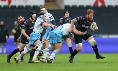 310116 - Ospreys v Glasgow - Guinness PRO12 - Dan Baker of Ospreys is tackled by Rory Hughes of Glasgow