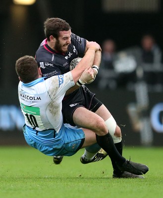 310116 - Ospreys v Glasgow - Guinness PRO12 - Tom Grabham of Ospreys is tackled by Duncan Weir of Glasgow