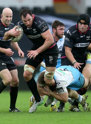 310116 - Ospreys v Glasgow - Guinness PRO12 - Joe Bearman of Ospreys is tackled by Pat MacArthur of Glasgow