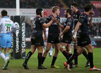 310116 - Ospreys v Glasgow - Guinness PRO12 - Dan Evans of Ospreys celebrates scoring a try with team mates