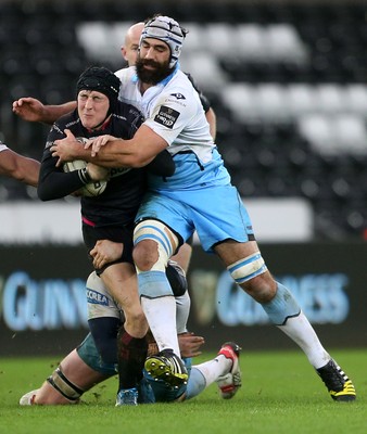 310116 - Ospreys v Glasgow - Guinness PRO12 - Sam Davies of Ospreys is tackled by Rob Harley and Josh Strauss of Glasgow