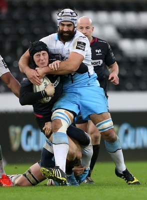 310116 - Ospreys v Glasgow - Guinness PRO12 - Sam Davies of Ospreys is tackled by Rob Harley and Josh Strauss of Glasgow