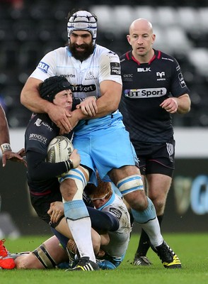 310116 - Ospreys v Glasgow - Guinness PRO12 - Sam Davies of Ospreys is tackled by Rob Harley and Josh Strauss of Glasgow