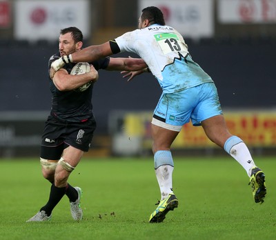 310116 - Ospreys v Glasgow - Guinness PRO12 - Joe Bearman of Ospreys is tackled by Taqele Naiyaravoro of Glasgow