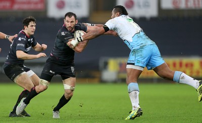 310116 - Ospreys v Glasgow - Guinness PRO12 - Joe Bearman of Ospreys is tackled by Taqele Naiyaravoro of Glasgow