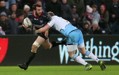 310116 - Ospreys v Glasgow - Guinness PRO12 - Tom Grabham of Ospreys is tackled by Glenn Bryce of Glasgow