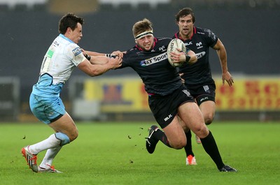 310116 - Ospreys v Glasgow - Guinness PRO12 - Scott Otten of Ospreys is tackled by Lee Jones of Glasgow