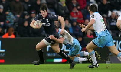 310116 - Ospreys v Glasgow - Guinness PRO12 - Owen Watkin of Ospreys is tackled by Duncan Weir of Glasgow