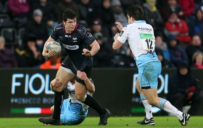 310116 - Ospreys v Glasgow - Guinness PRO12 - Owen Watkin of Ospreys is tackled by Duncan Weir and Sam Johnson of Glasgow