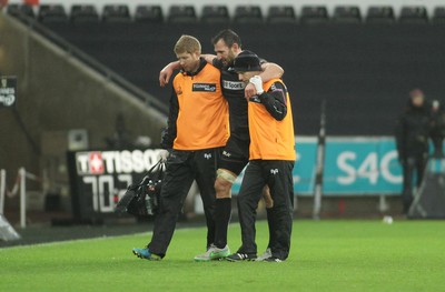 310116 - Ospreys v Glasgow Warriors - GuinnessPro12 -Joe Bearman of Ospreys is helped from the field