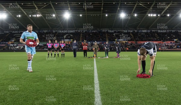 021118 - Ospreys v Glasgow Warriors, Guinness PRO14 - Callum Gibbins of Glasgow Warriors and Olly Cracknell of Ospreys lay wreaths in Remembrance at the the start of the match