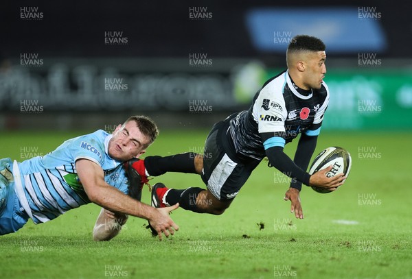 021118 - Ospreys v Glasgow Warriors, Guinness PRO14 - Keelan Giles of Ospreys is tackled by Stafford McDowall of Glasgow Warriors