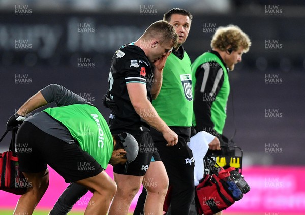 111123 - Ospreys v Glasgow - United Rugby Championship - Keiran Williams of Ospreys leaves the field with medical staff