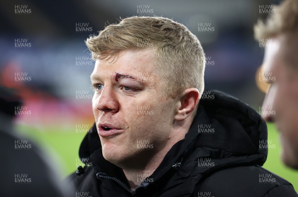 111123 - Ospreys v Glasgow Warriors - United Rugby Championship - Keiran Williams of Ospreys with a stitched up eye brow after the game
